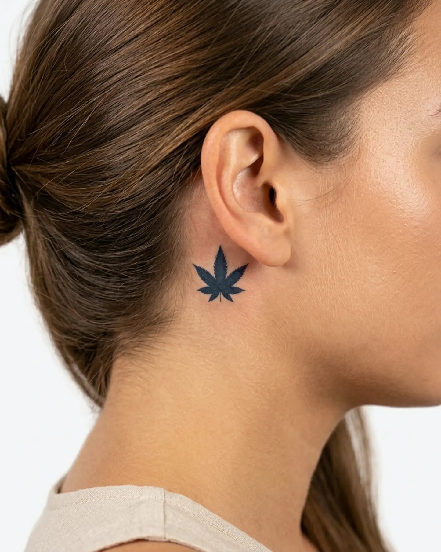 INKY Canna Leaf semi-permanent tattoo applied on a woman – 0.5 x 0.5 in (1x1 cm) design, realistic ink look, lasts 10 days