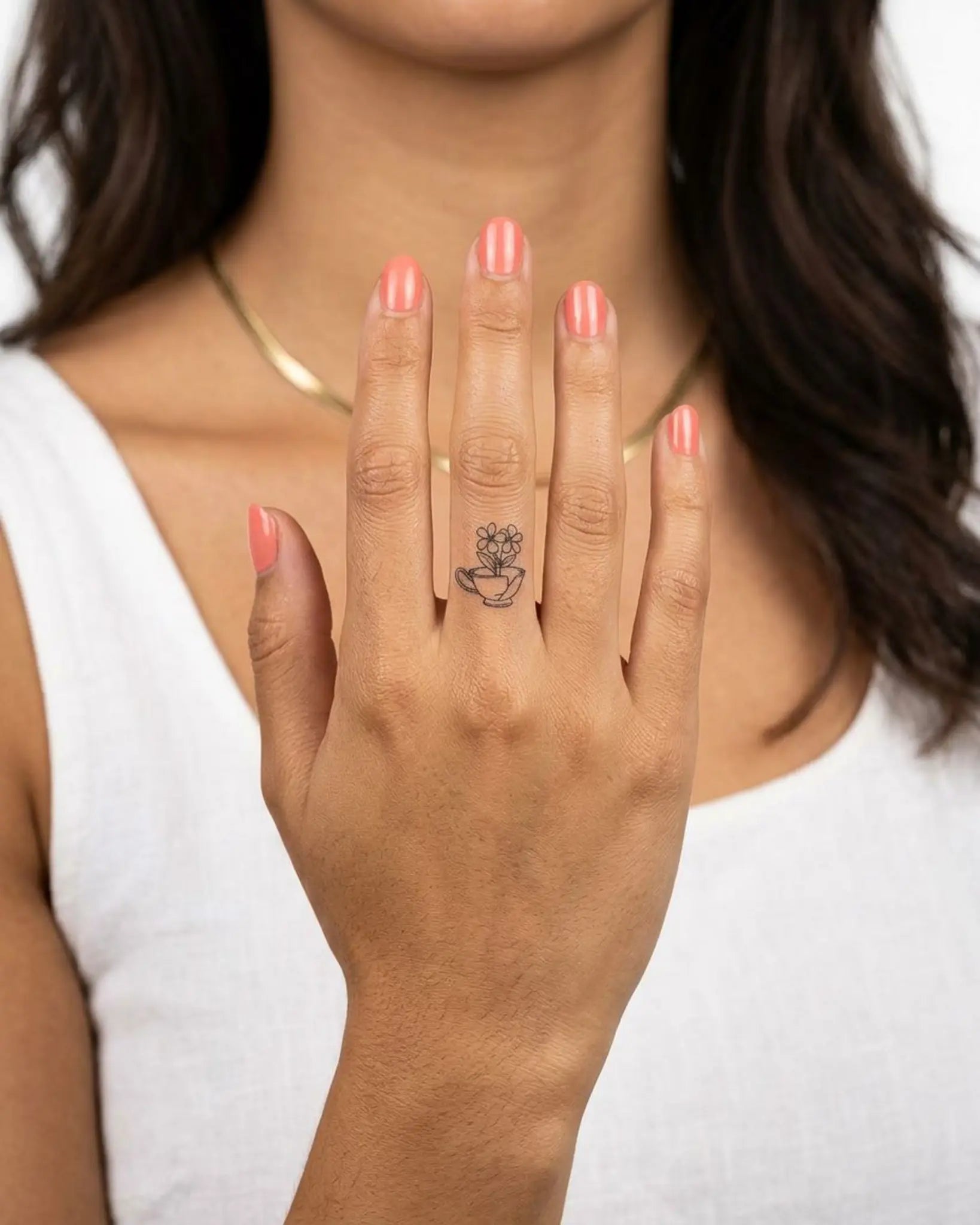 INKY Broken Bloom semi-permanent tattoo applied on a woman – 0.5 x 0.5 in (1x1 cm) design, realistic ink look, lasts 10 days