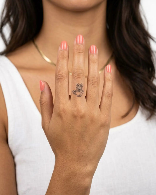INKY Broken Bloom semi-permanent tattoo applied on a woman – 0.5 x 0.5 in (1x1 cm) design, realistic ink look, lasts 10 days