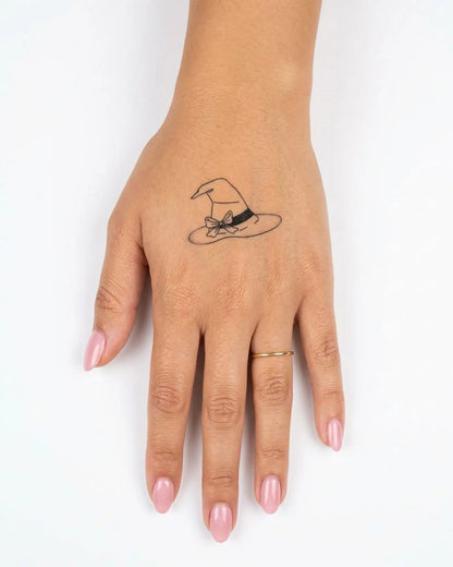 INKY Witch Hat semi-permanent tattoo applied on a woman – 2 x 2 in (4x4 cm) design, realistic ink look, lasts 10 days