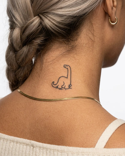 INKY Cute Dino semi-permanent tattoo applied on a woman – 2 x 2 in (4x4 cm) design, realistic ink look, lasts 10 days