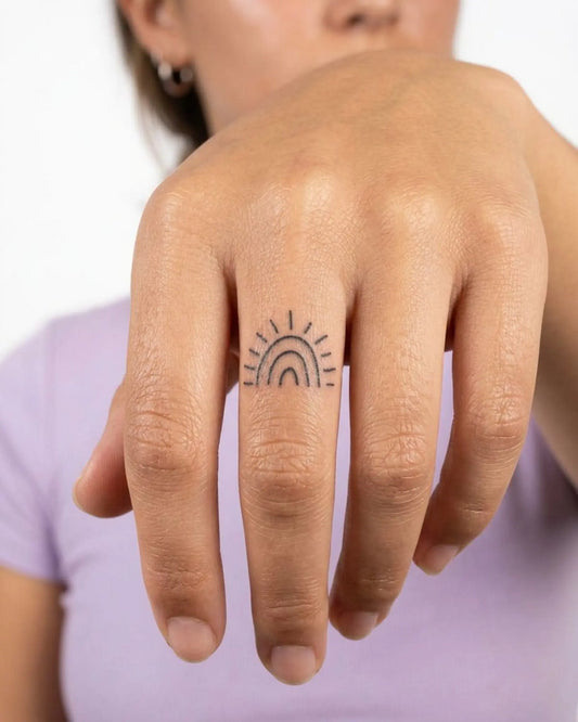 INKY Mini Sun semi-permanent tattoo applied on a woman – 0.5 x 0.5 in (1x1 cm) design, realistic ink look, lasts 10 days